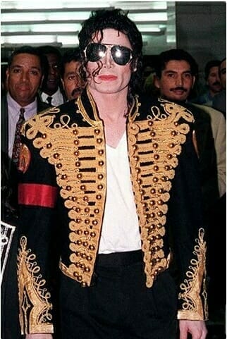 MJ wearing a military style jacket